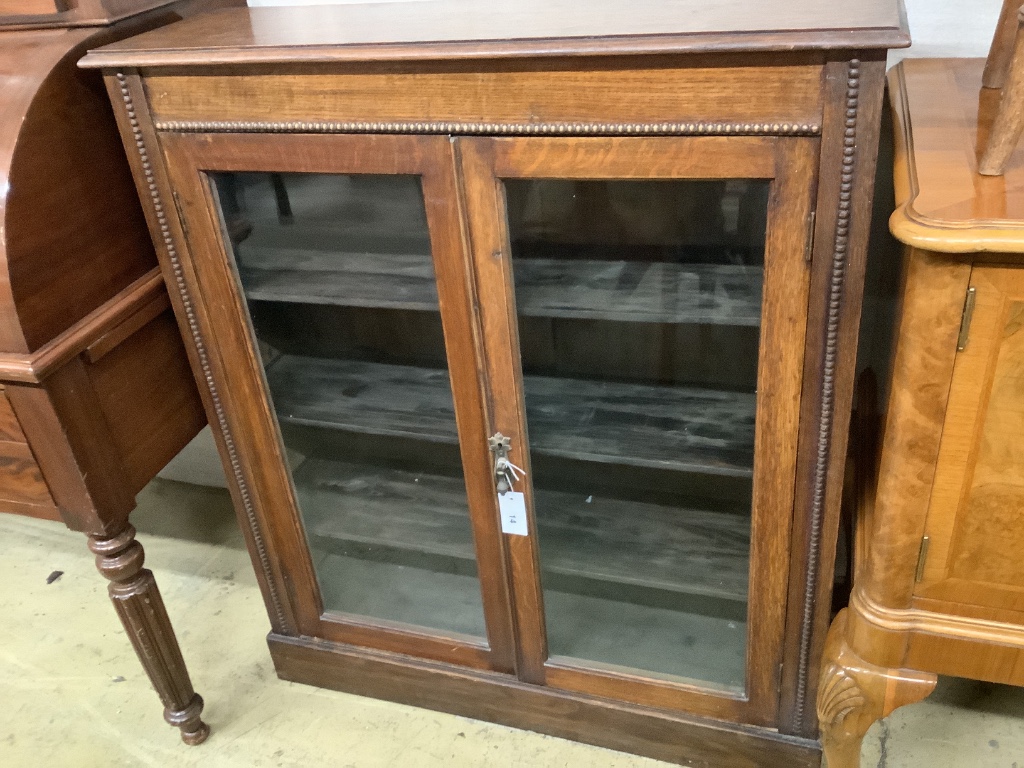 An early 20th century oak pier cabinet, width 90cm depth 28cm height 104cm